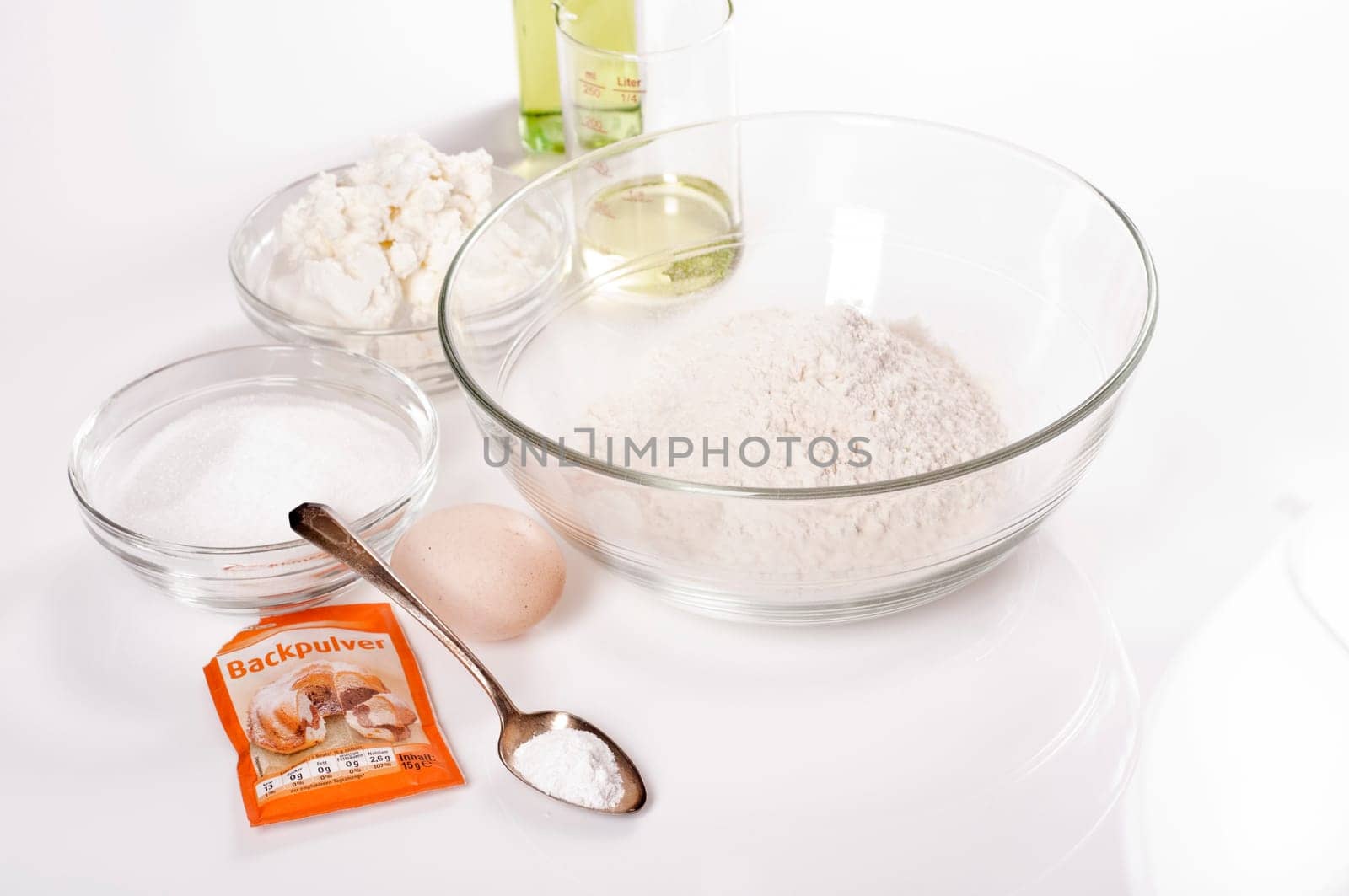 Ingredients for quark oil dough on white background