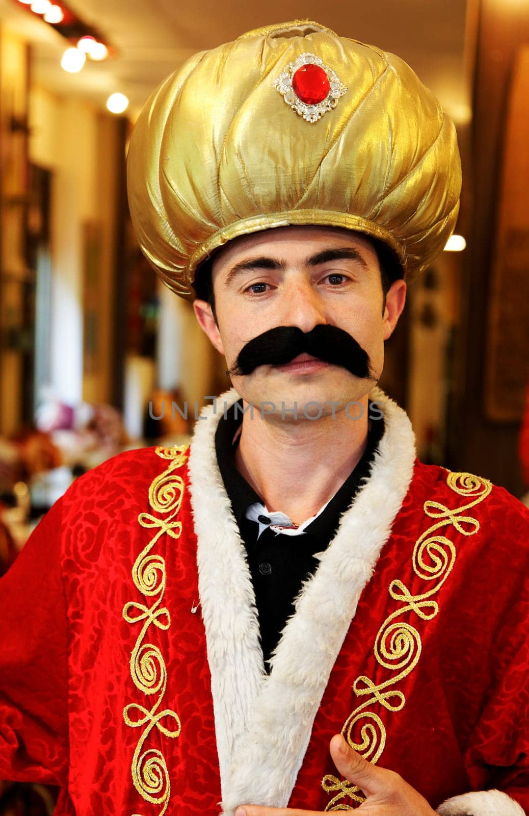 Istanbul, Turkey - June, 2011: Portrait of a Turkish waiter dressed up as a sultan for a restaurant feature