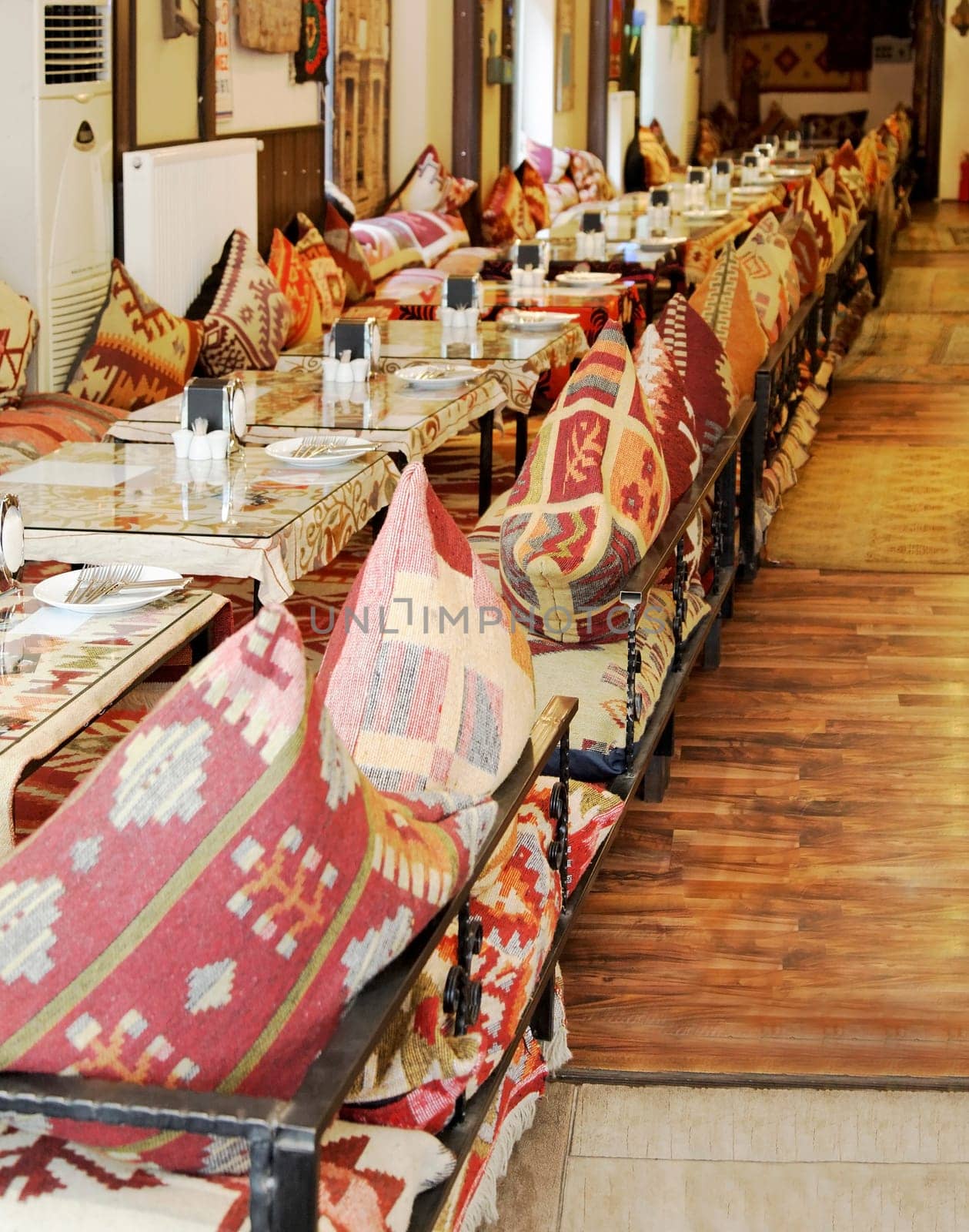 Istanbul, Turkey - June, 2011: restaurant table set for a large party upto 24 diners with colorful table ware