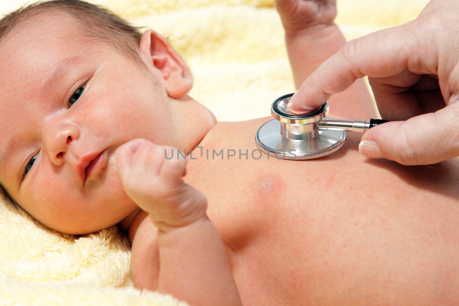 Stethoscope listening to a baby&#039 s heart beat