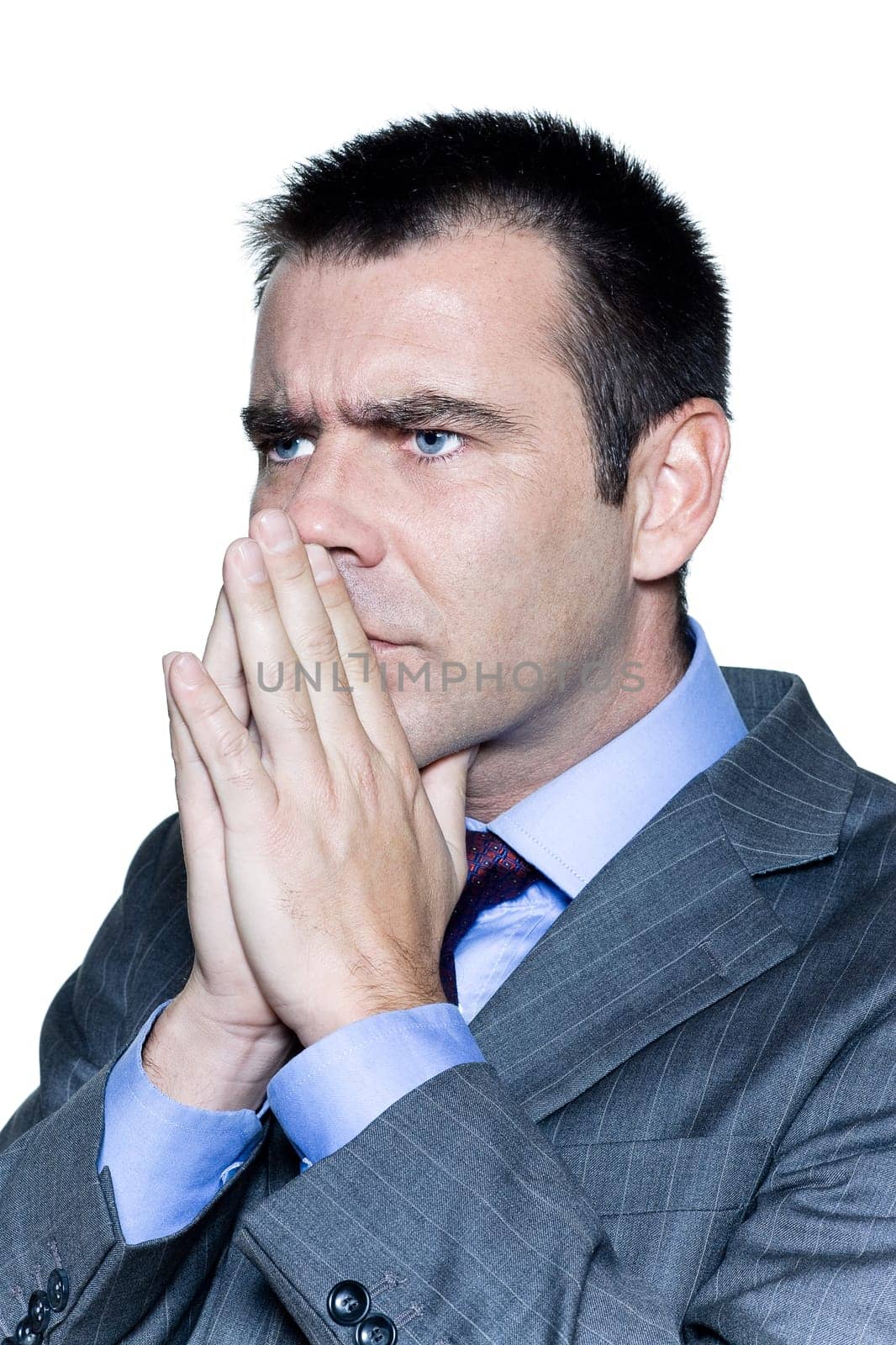 Closeup portrait of a pensive worried businessman in studio on isolated white background