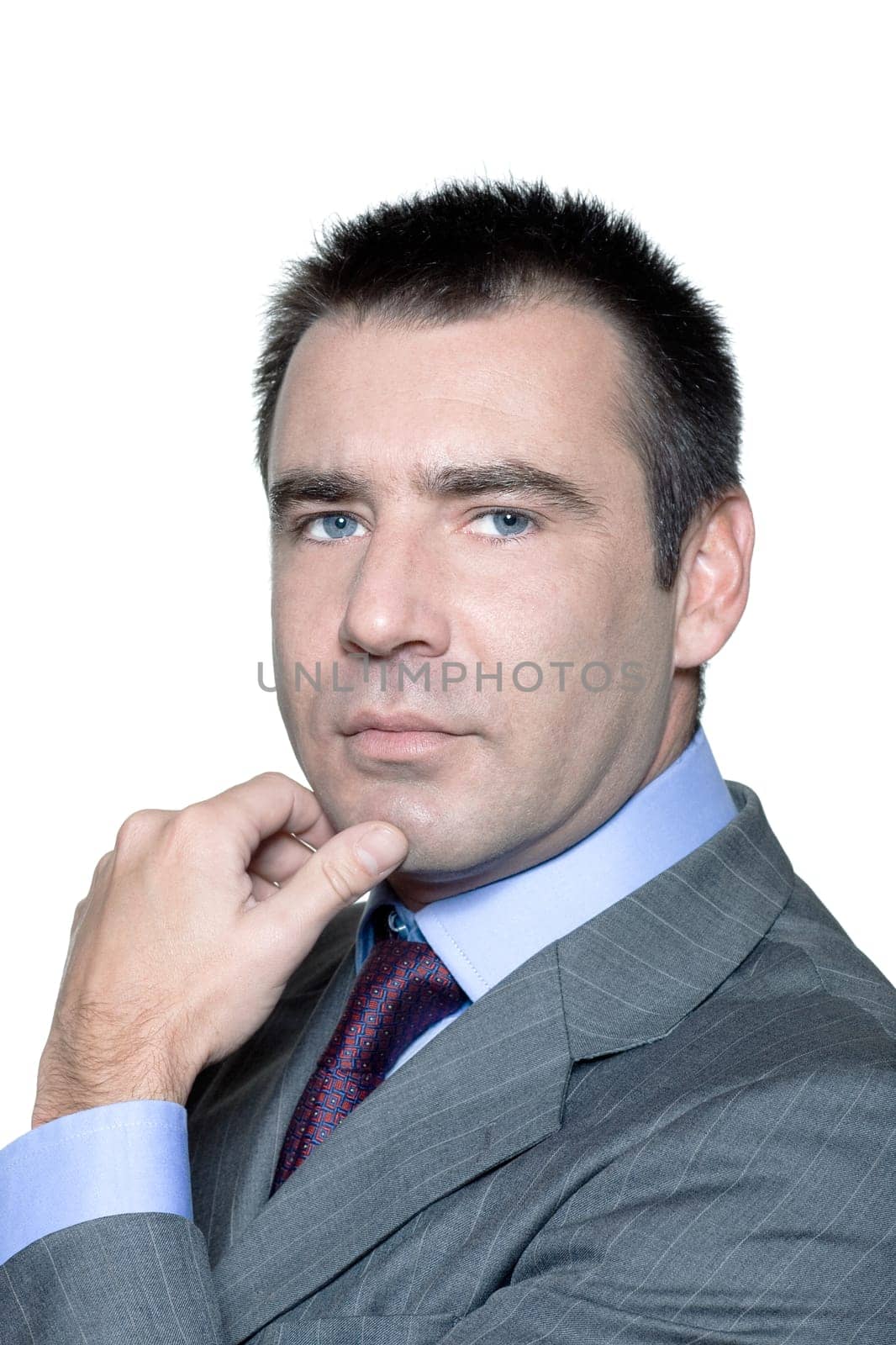 Closeup portrait of a serious handsome businessman in studio on isolated white background