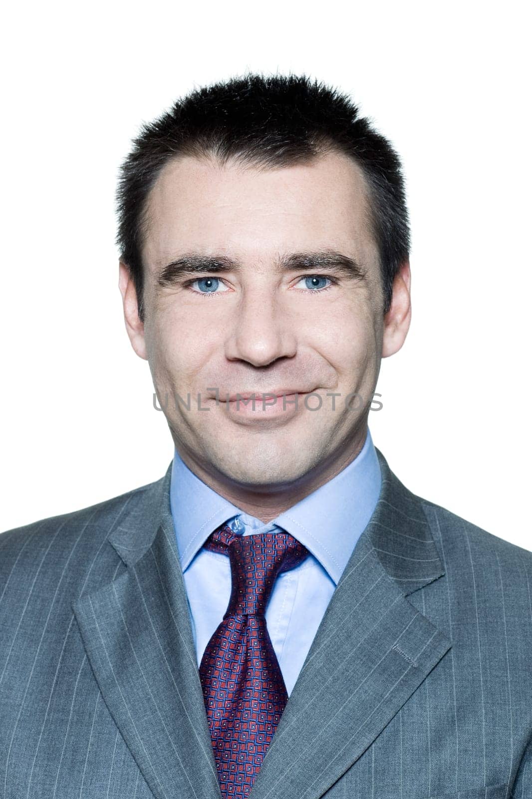 Closeup portrait of a smiling handsome man in studio on isolated white background