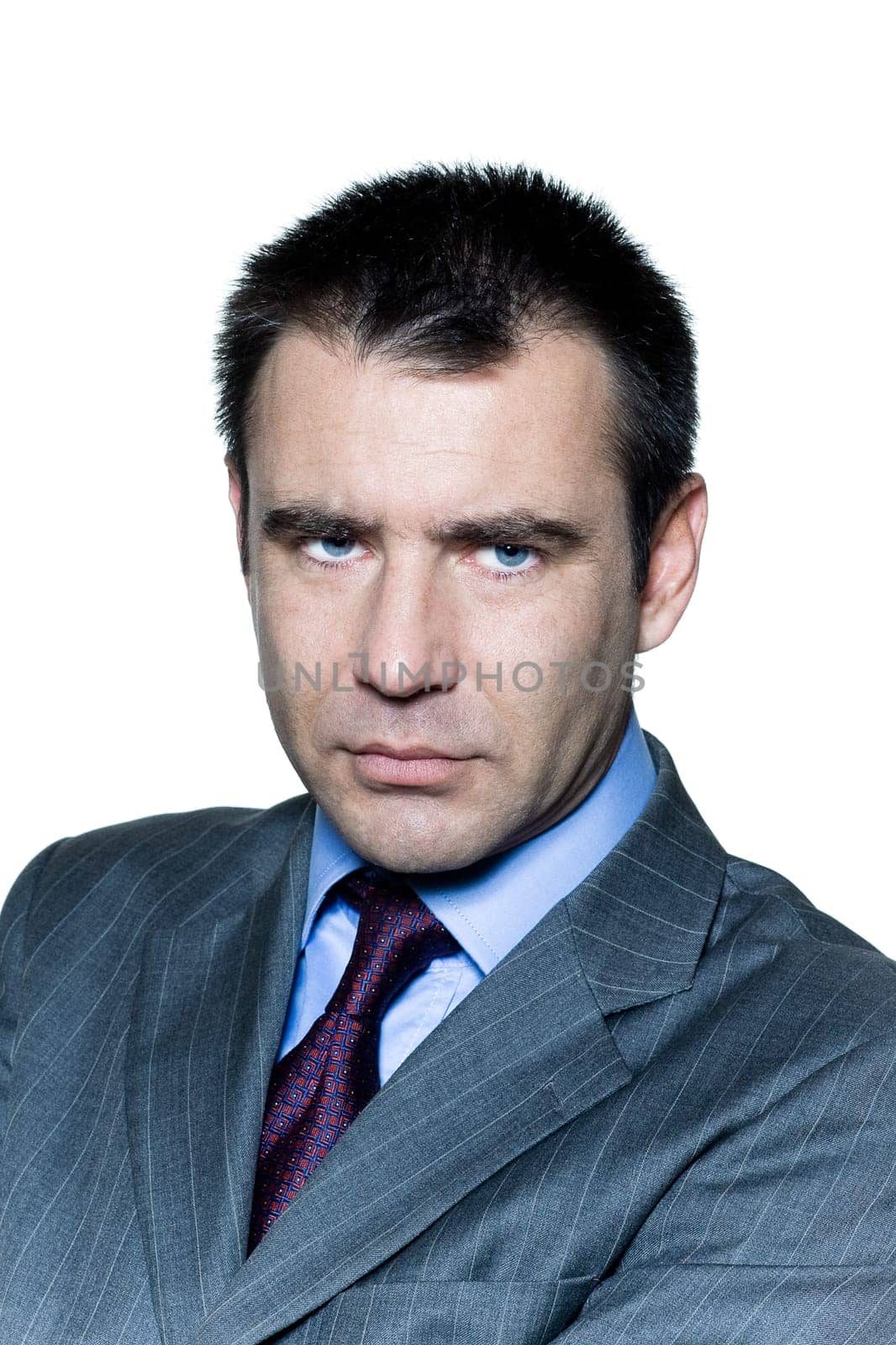 Closeup portrait of a pensive worried businessman in studio on isolated white background