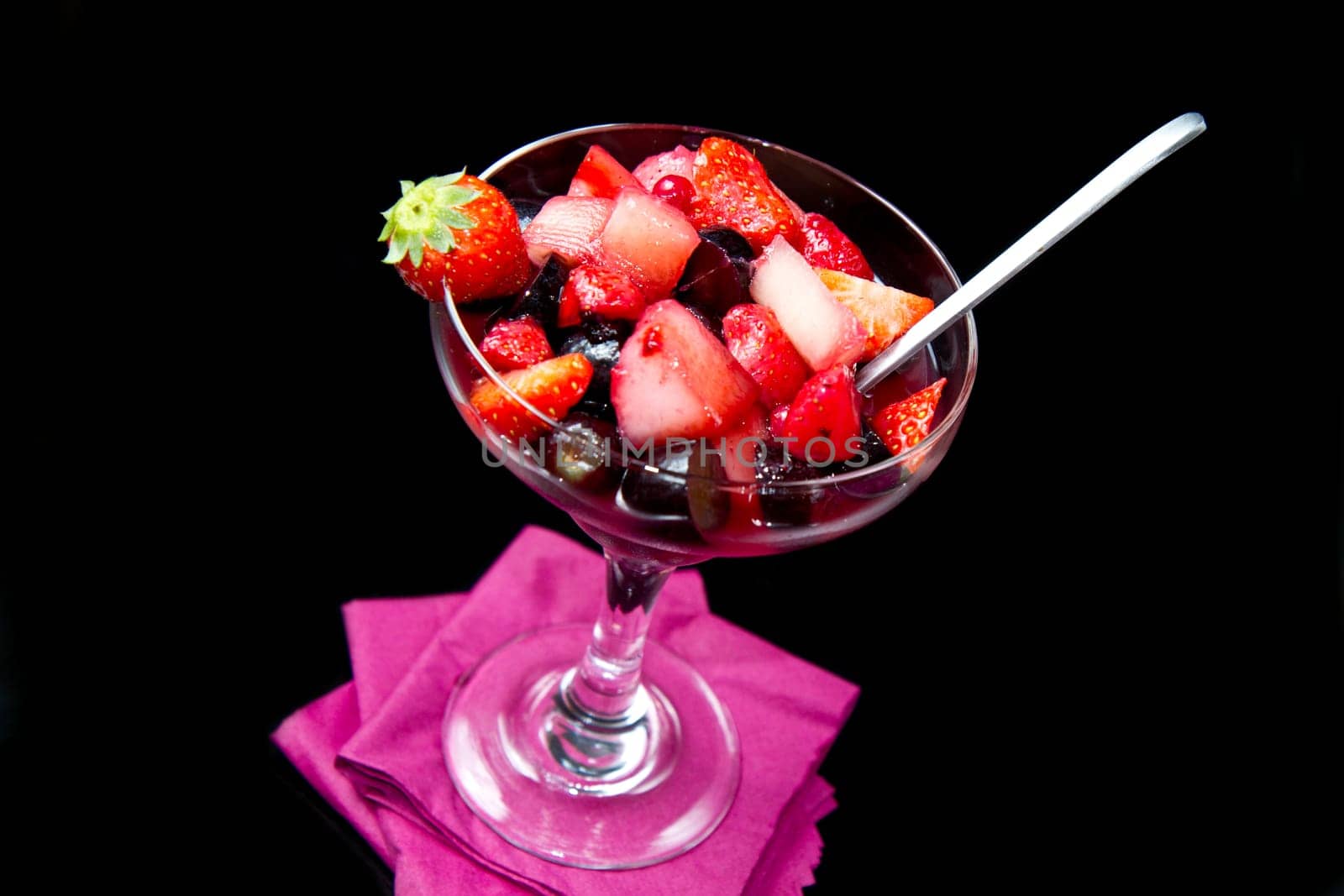 fresh fruit salad on black background