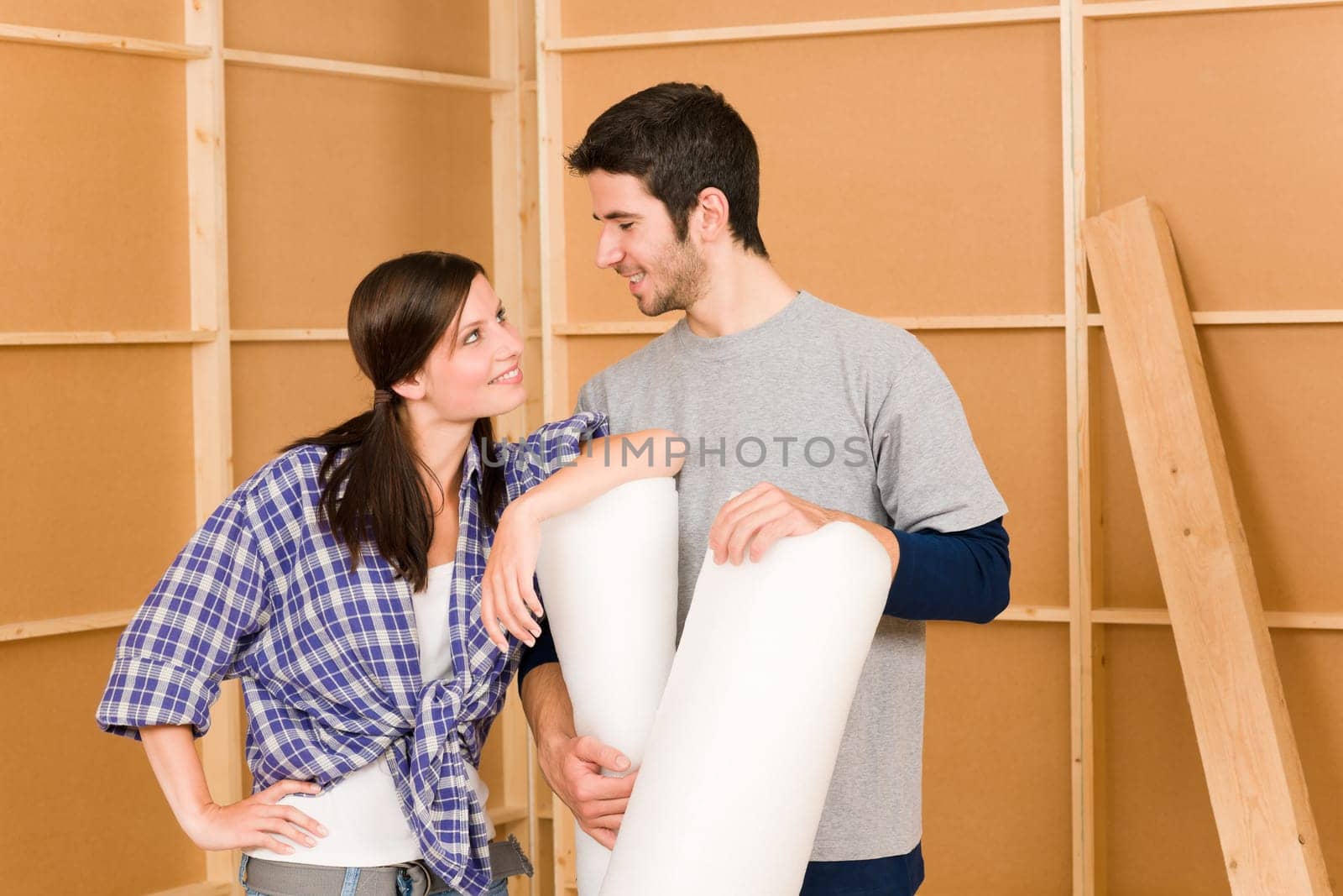 Home improvement young couple working on floor renovations