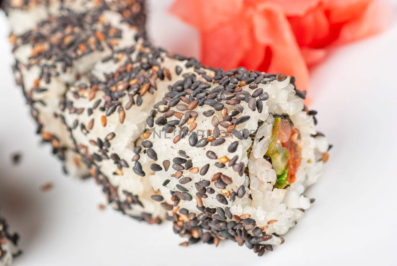 Closeup of Sushi rolls at plate with sesame