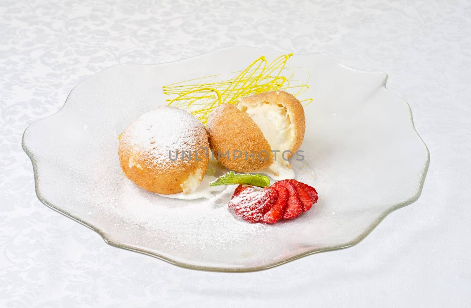 Dessert of ice-cream at biscuit with strawberry and caramel