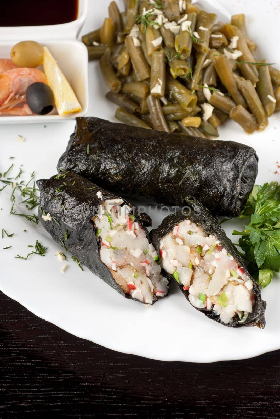 souffle of fillet of pikeperch, shrimps, crab meat, coconut and leek wrapped at nori garnished by string beans