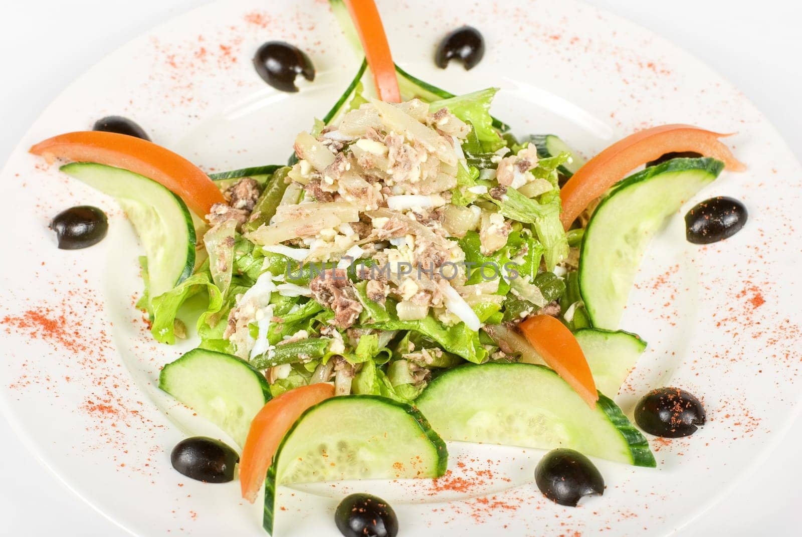 Salad of tuna fish with string beans, eggs, lettuce, boiled potato and fresh cucumbers and tomato