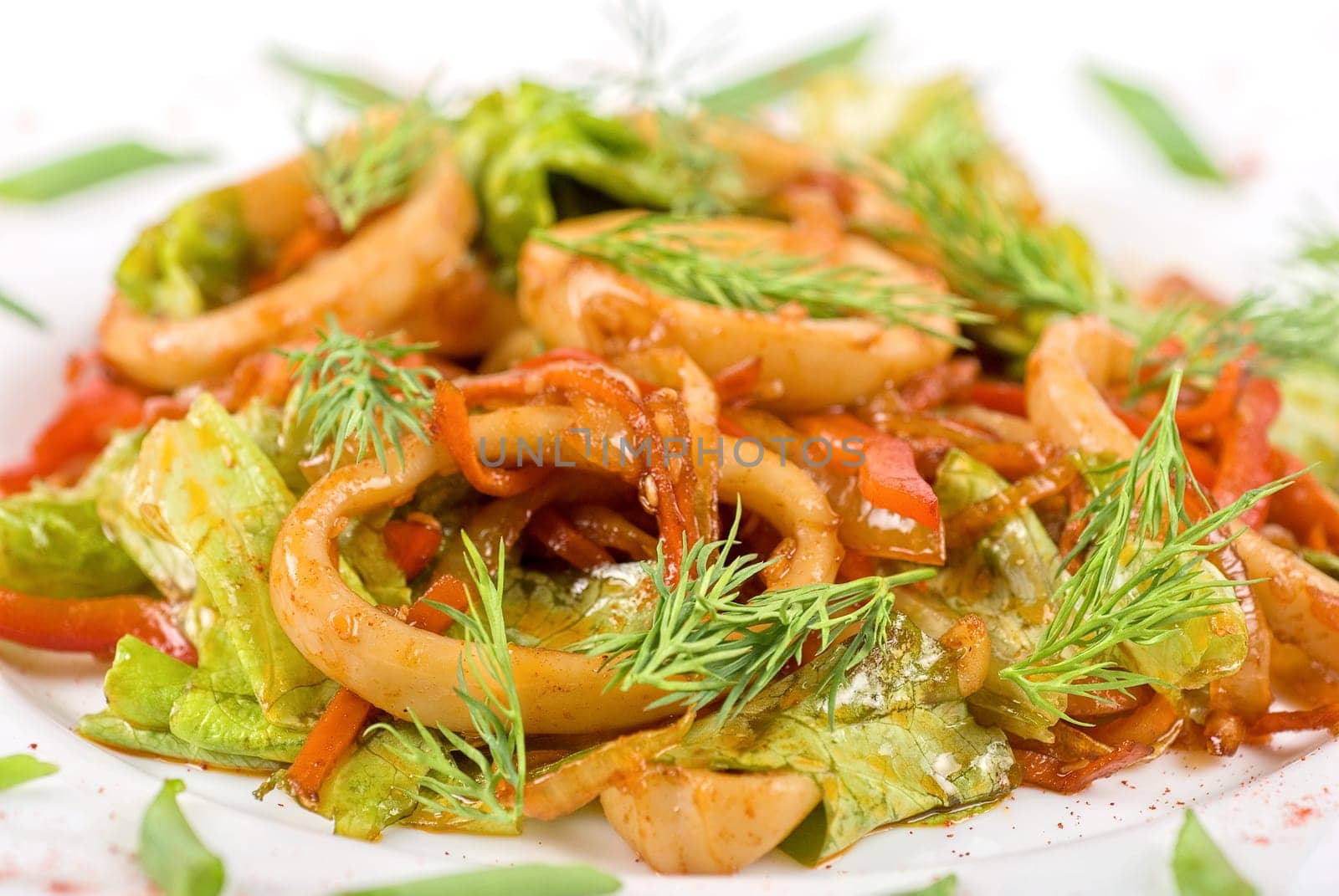 Seafood salad with squid and vegetables closeup