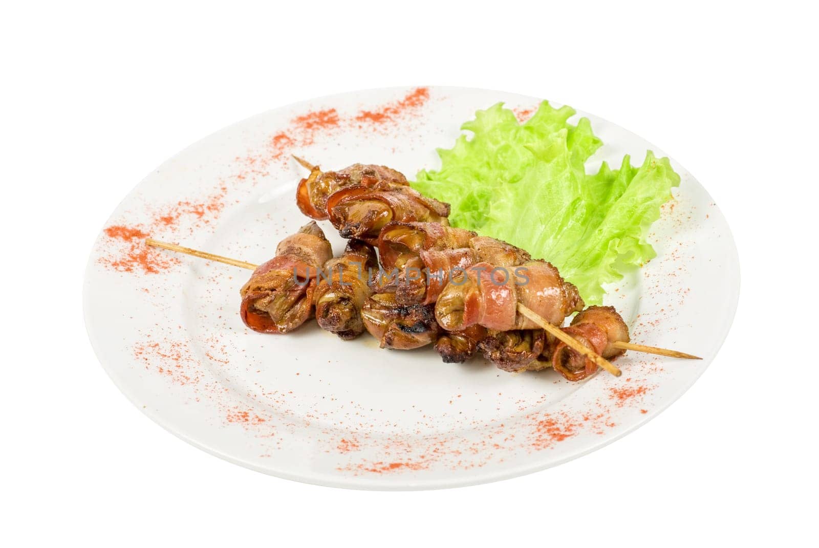 Kebab from chicken liver wrapped with bacon and garlic sauce