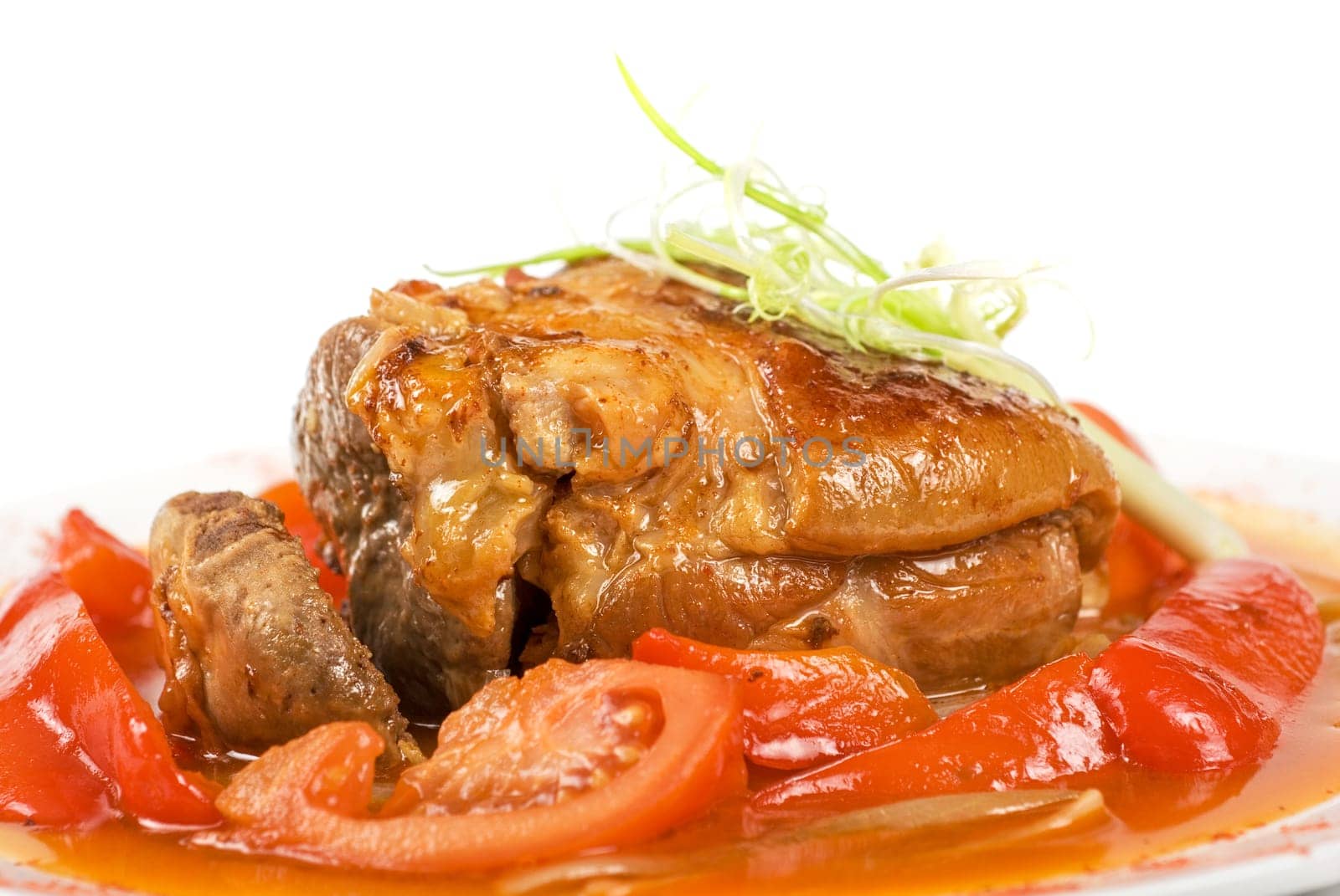 knuckle of veal baked with vegetables closeup