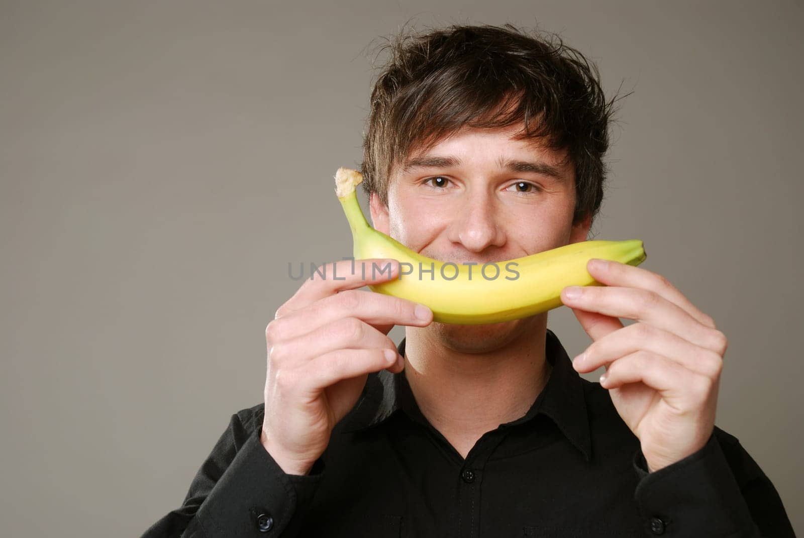 Young man with banana