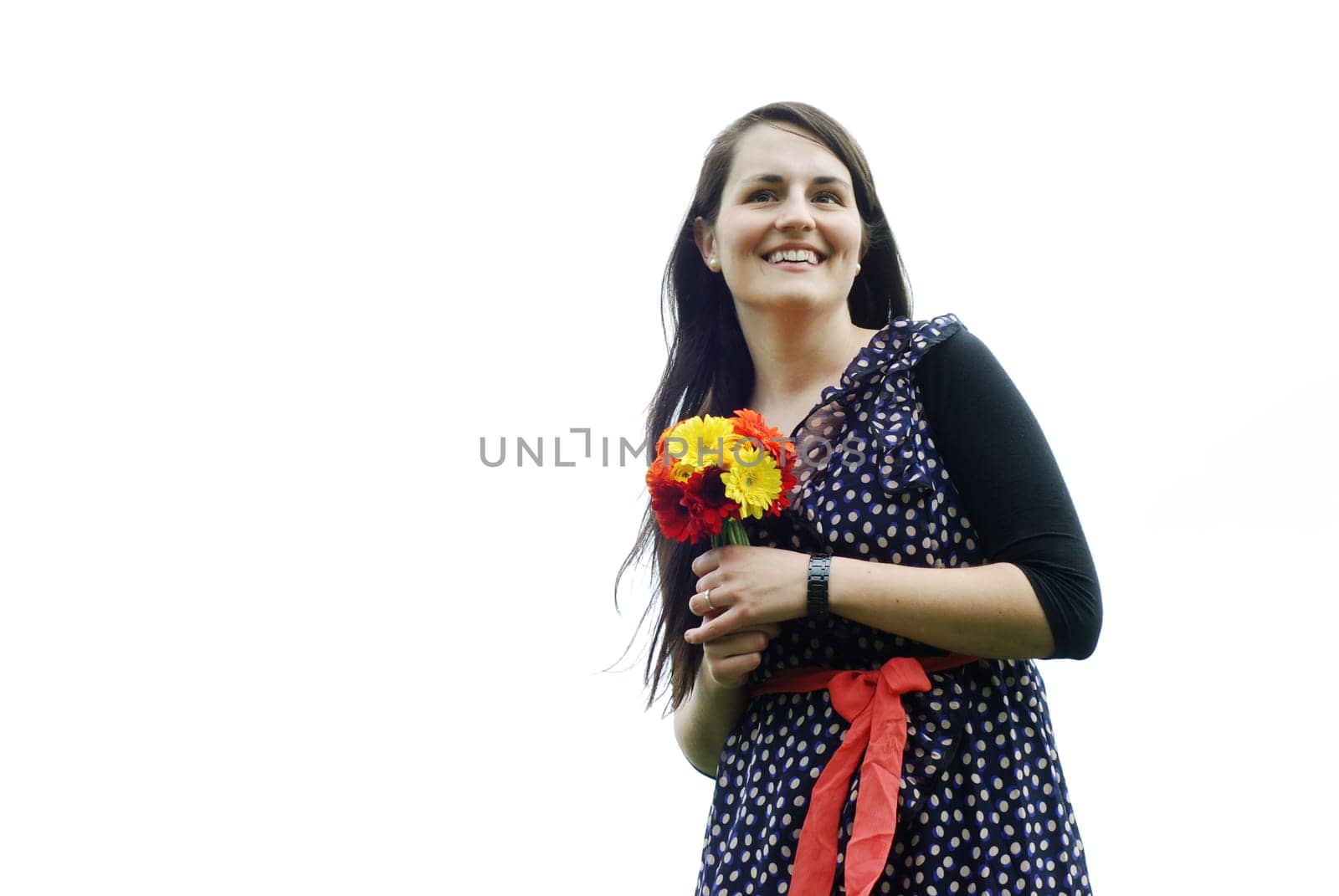 Young woman with gerberas
