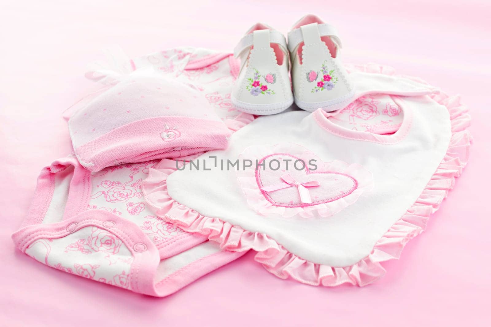 Pink infant girl clothing for baby shower