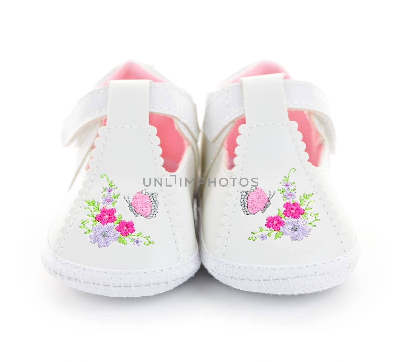 Closeup of girl baby shoes isolated on white background