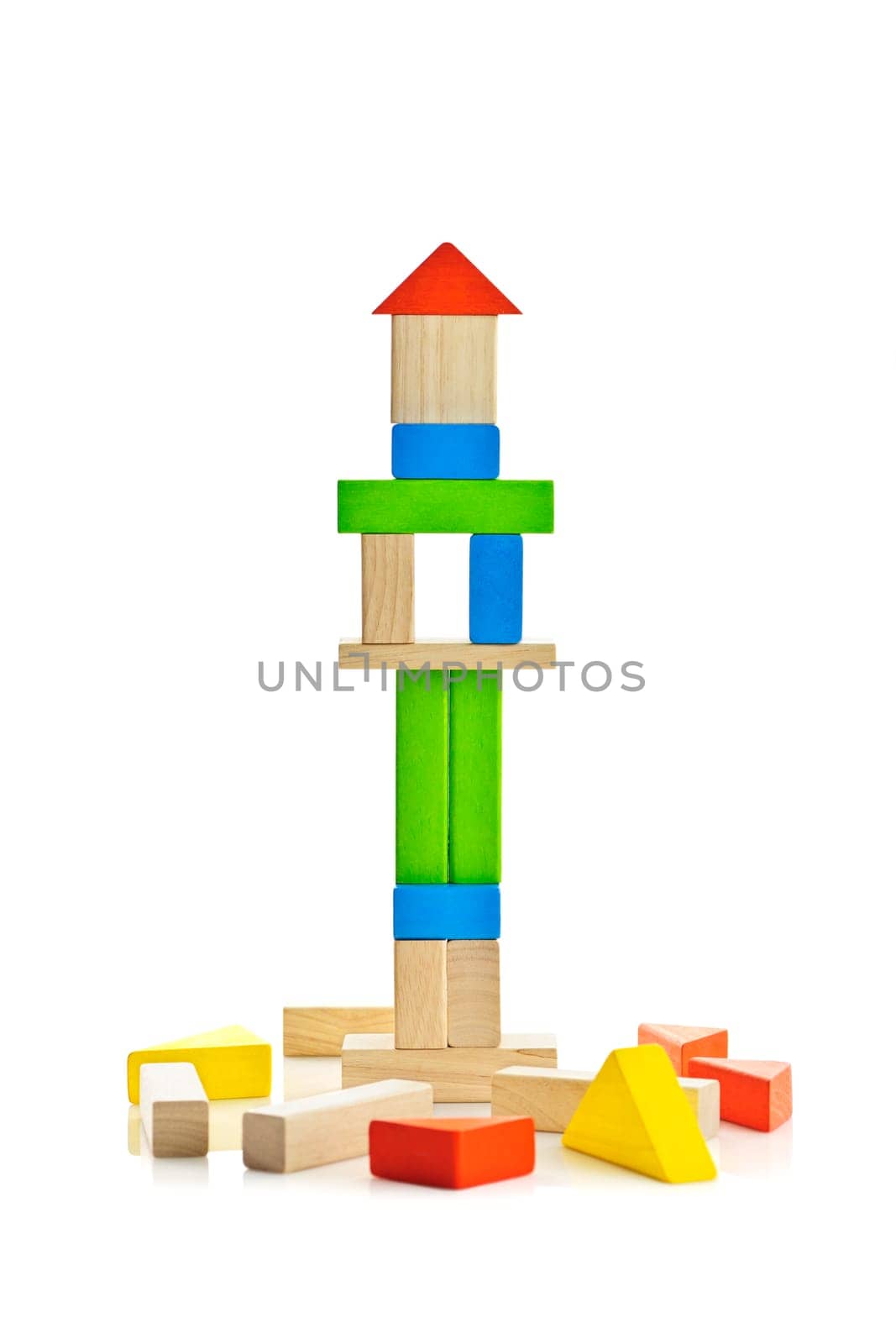 Tower of wooden building block toys isolated on white background