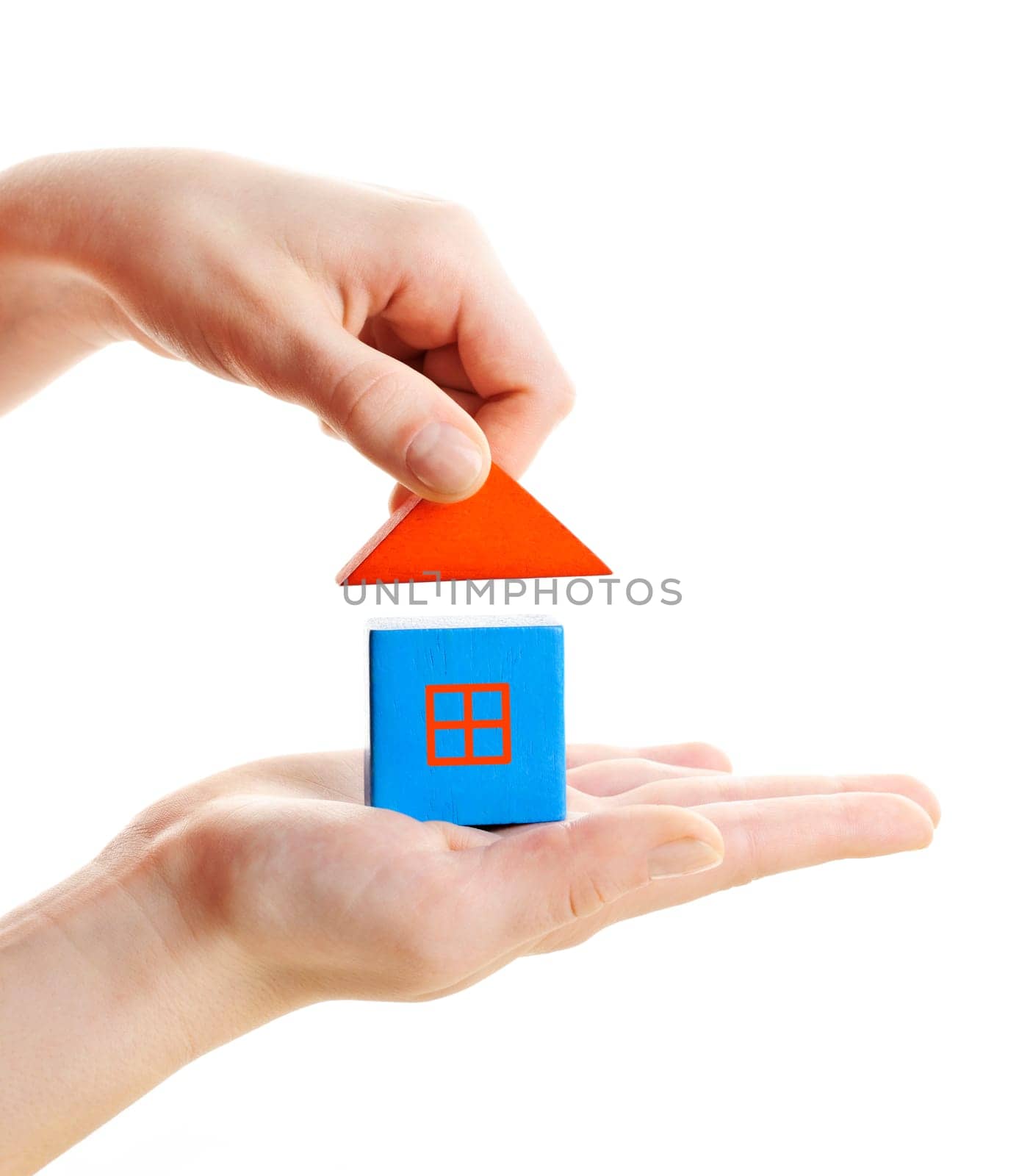 Hand building wooden block toy house isolated on white background