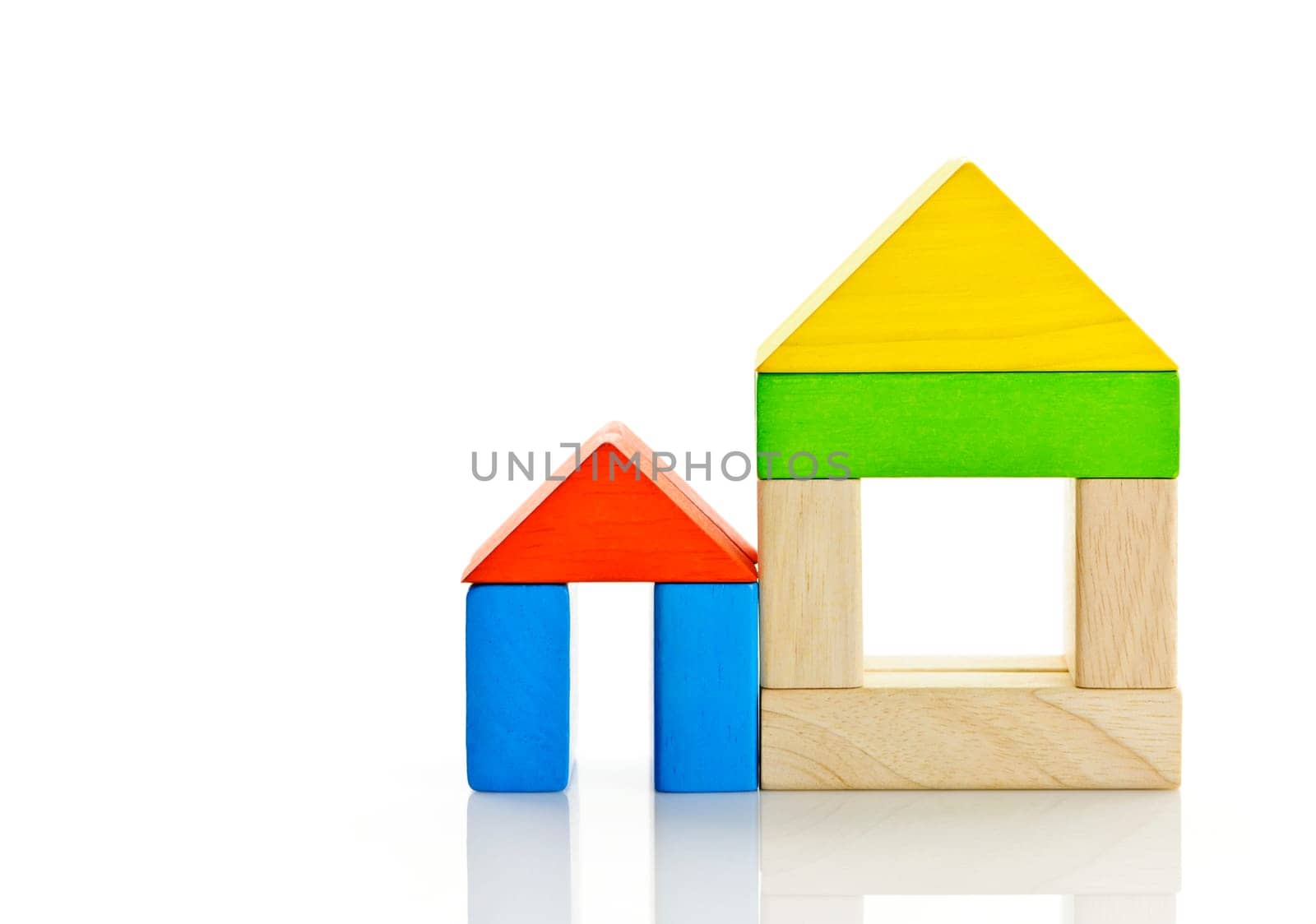 Houses built out of toy wooden building blocks