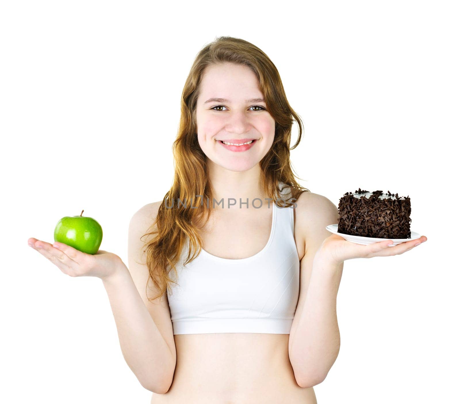 Smiling young woman holding apple and chocolate cake