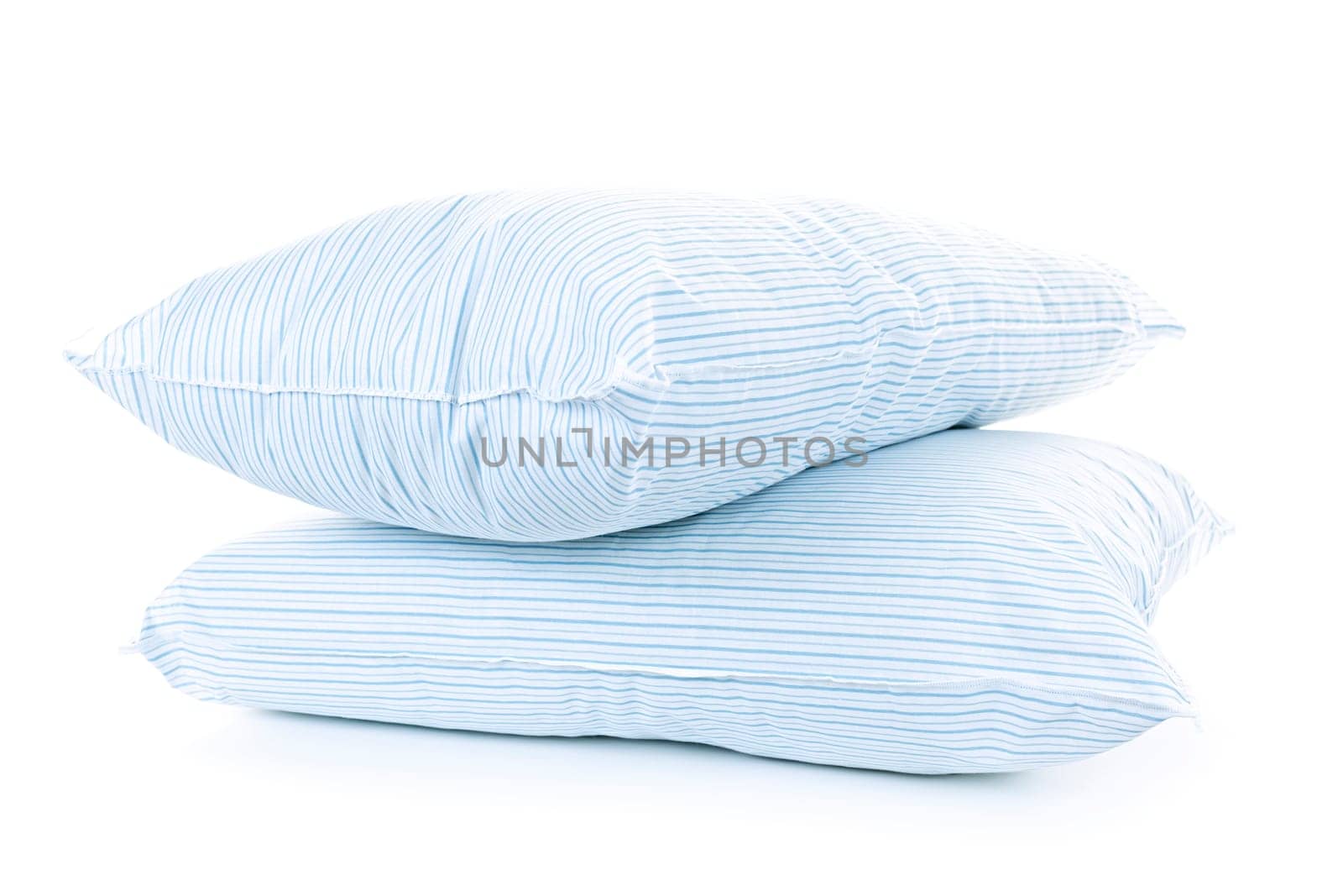 Two soft pillows with blue striped covers isolated on white background