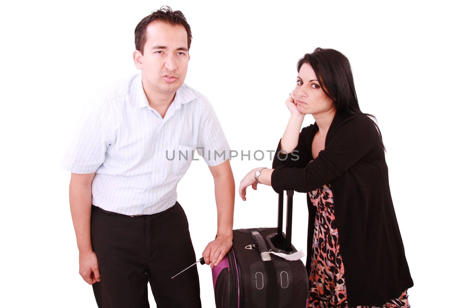 caucasian businesswoman and businessman stand impatiently as they wait for a flight
