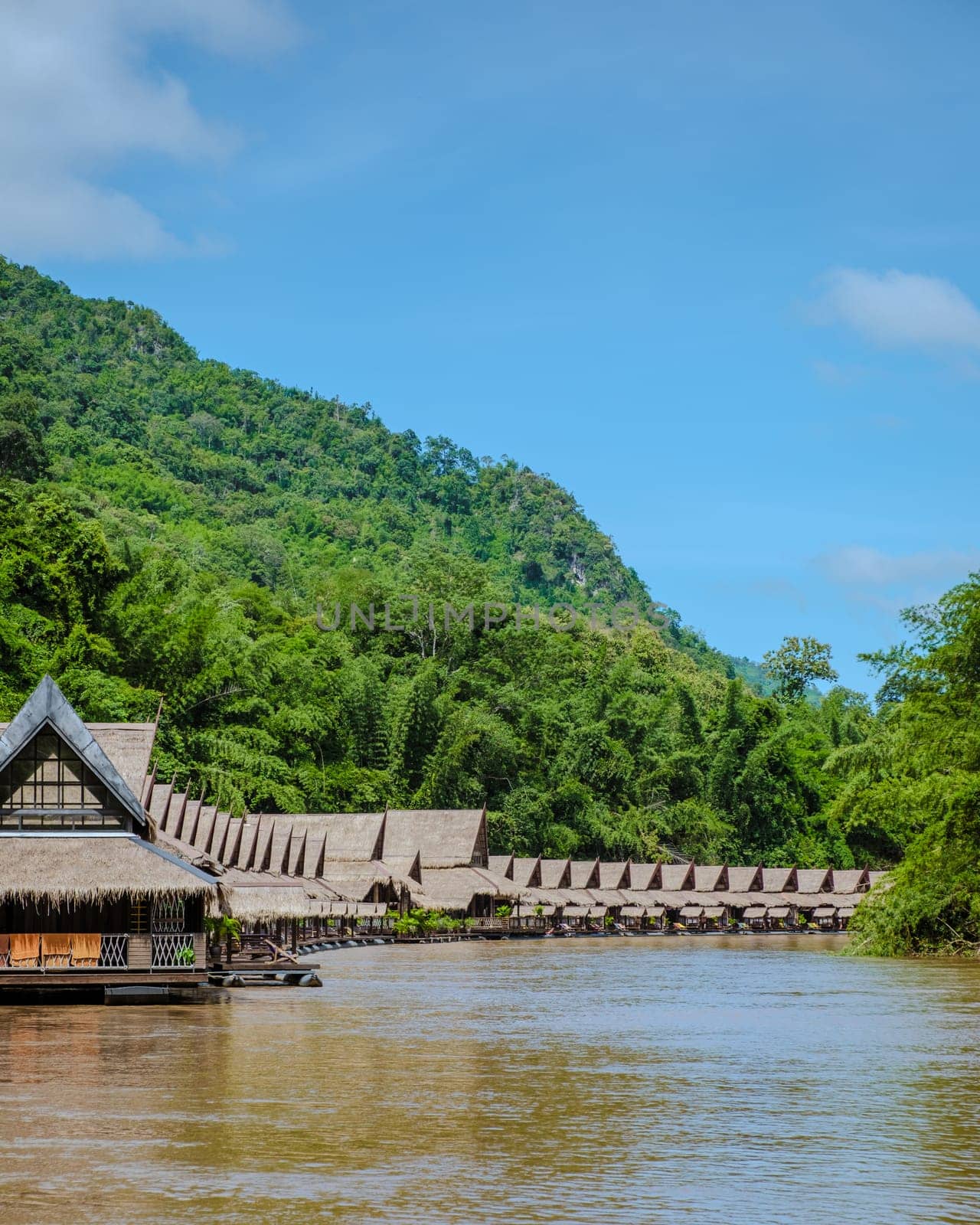 Tropical beach houses on the River Kwai in Thailand.Wooden floating raft house in river Kwai Kanchanaburi, Thailand