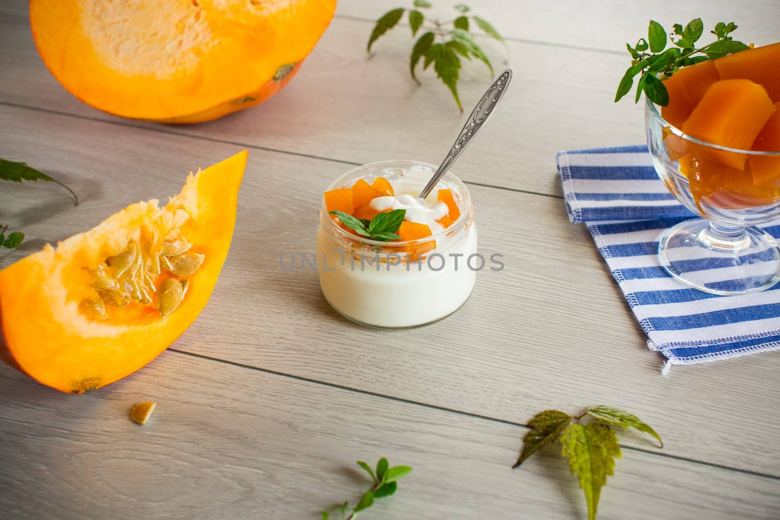 Homemade yogurt with pieces of pumpkin marmalade. Autumn recipes.