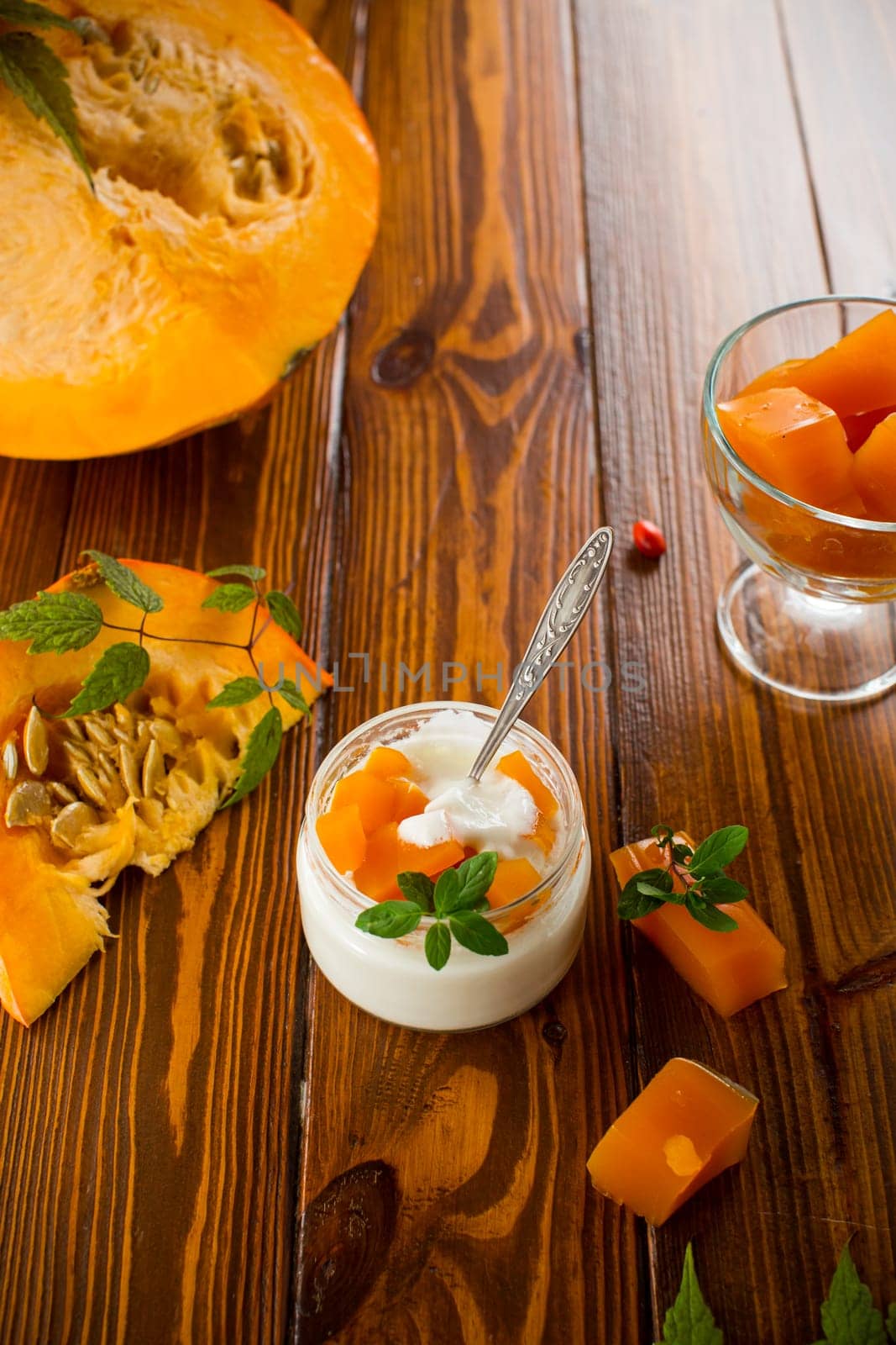 Homemade yogurt with pieces of pumpkin marmalade. Autumn recipes.