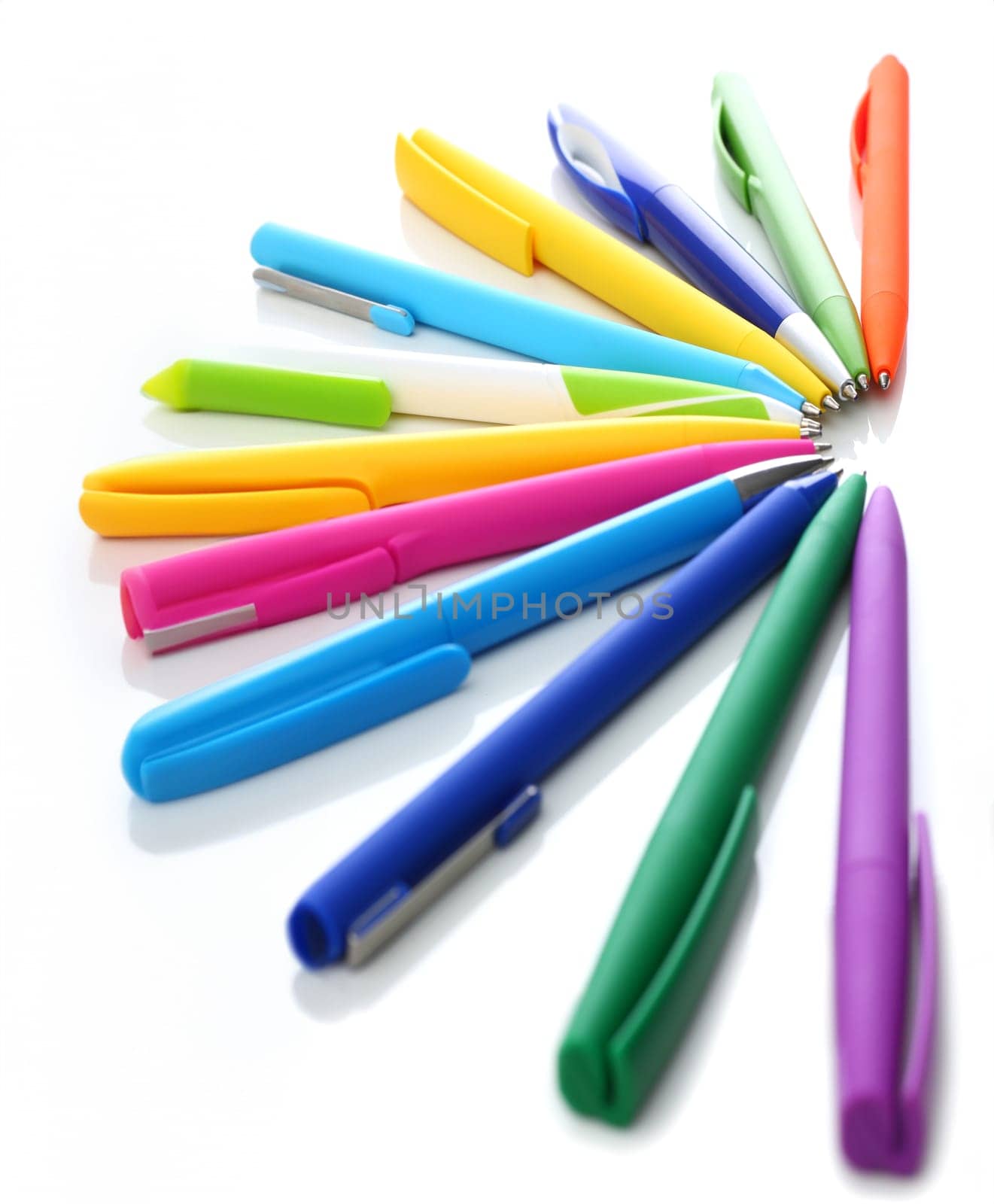 Multi colored ball pens on white background by kuprevich
