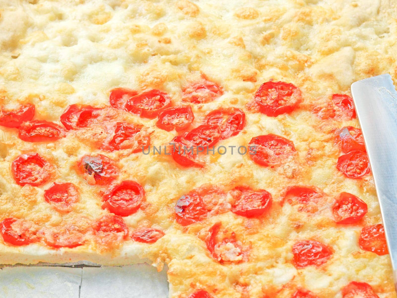 Italian Pizza with tomato topping useful as a background