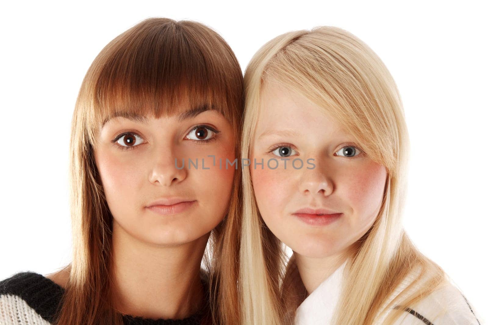 Portrait two girls of the blonde and brunettes insulated on white background