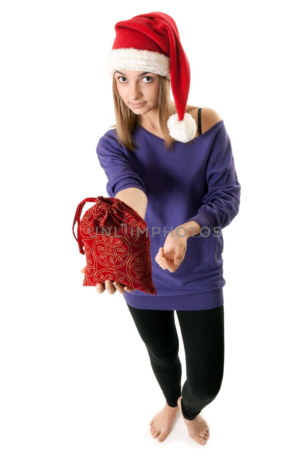 Beautiful girl in red Santa hat on a white background