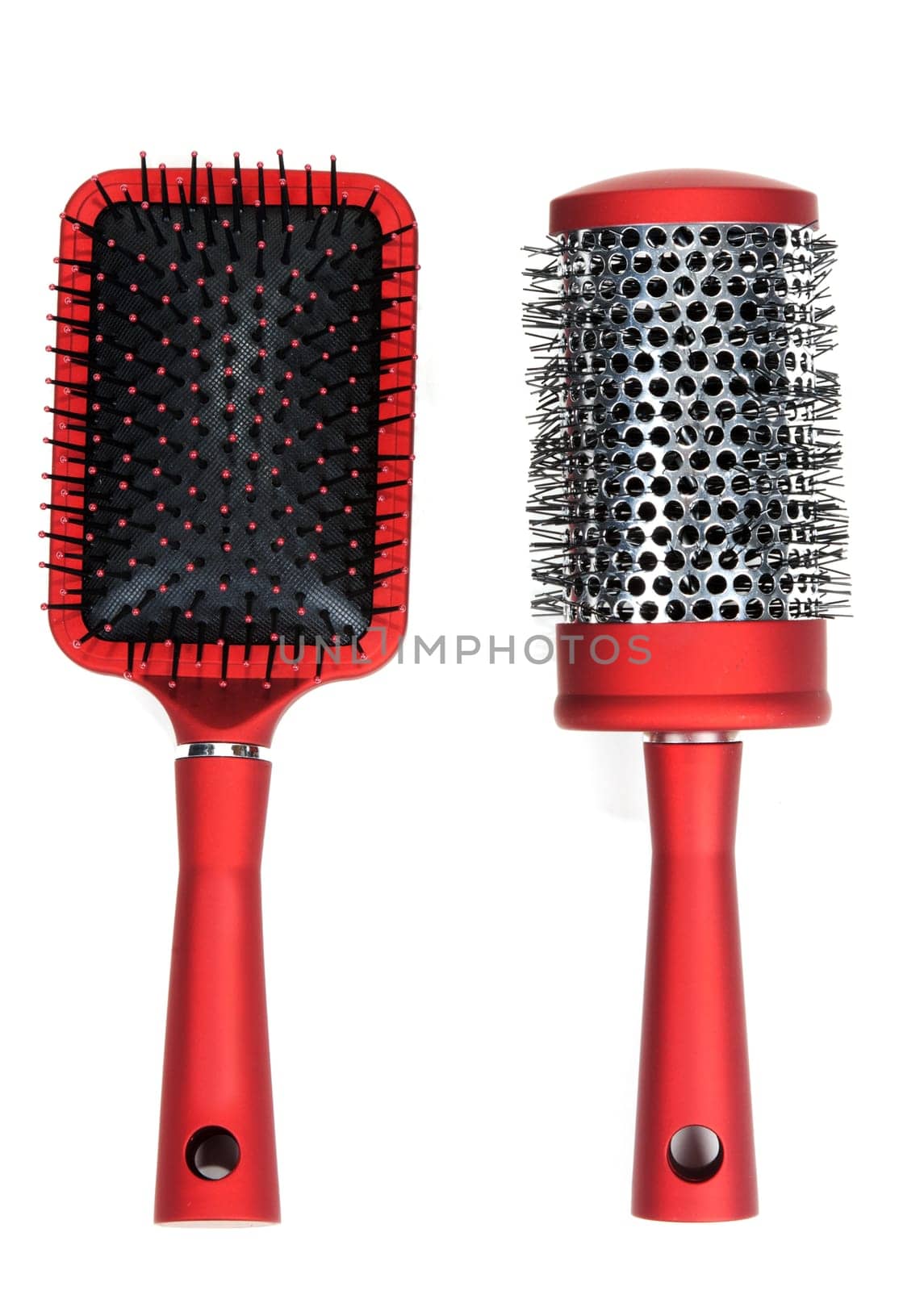 Two red massages comb on white background