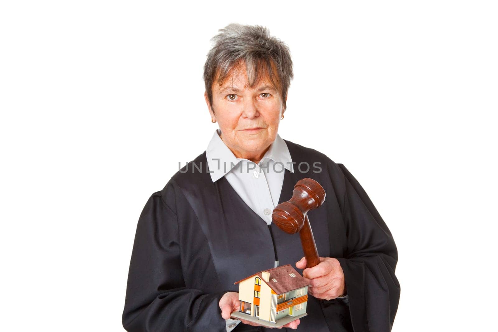 Lawyer with a gavel and model house