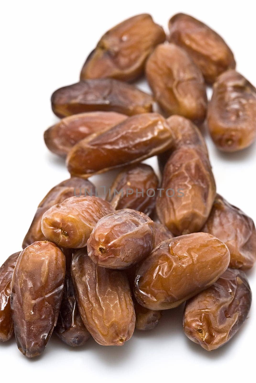 Date fruit isolated over a white background.