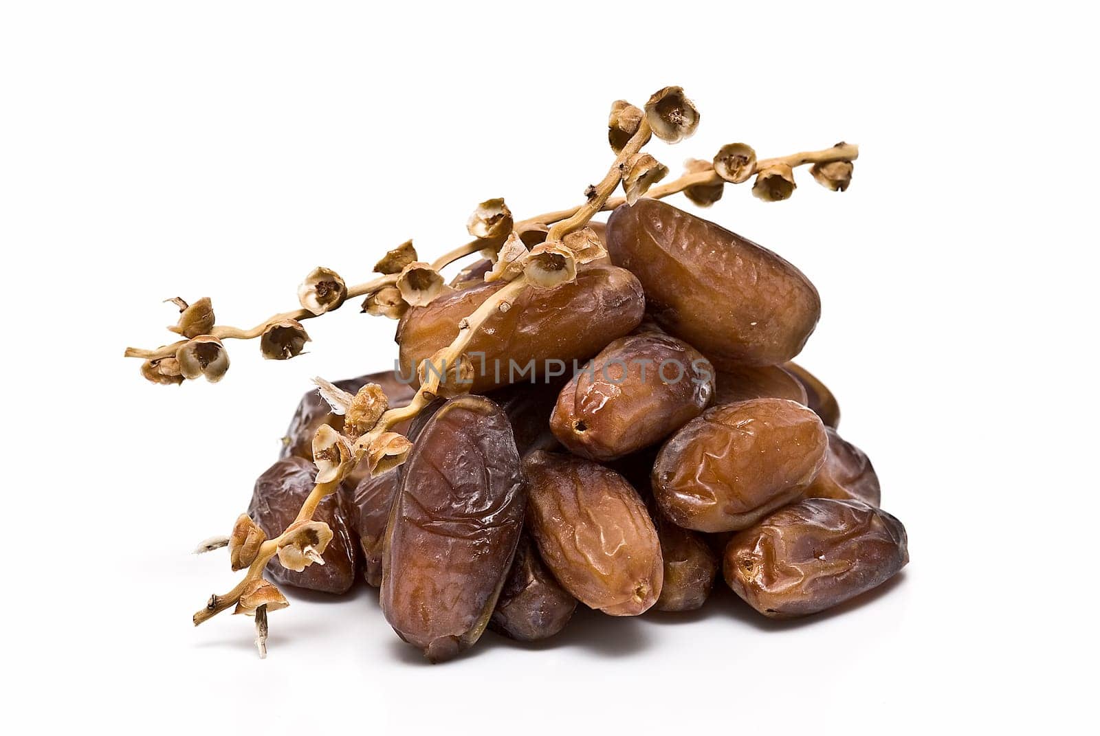 Date fruit isolated over a white background.
