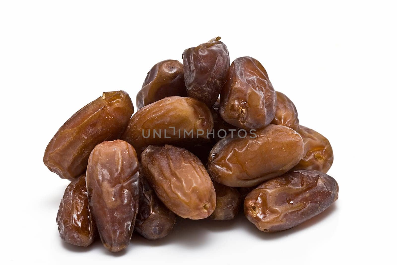 Date fruit isolated over a white background.