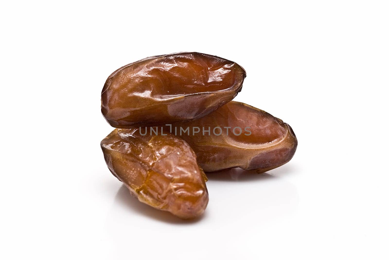Date fruit isolated over a white background.