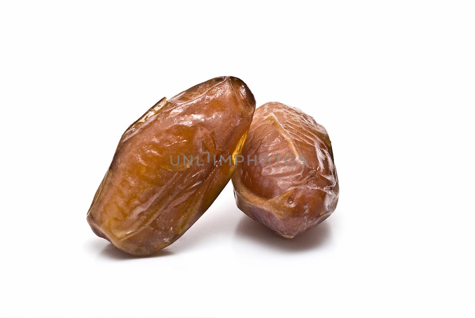 Date fruit isolated over a white background.