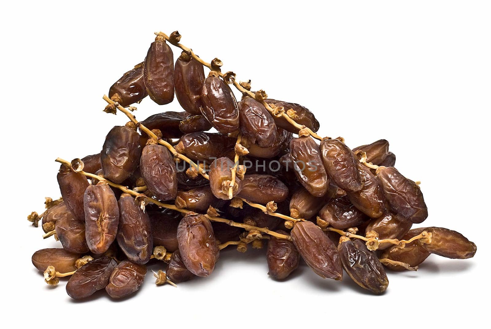 Date fruit isolated over a white background.