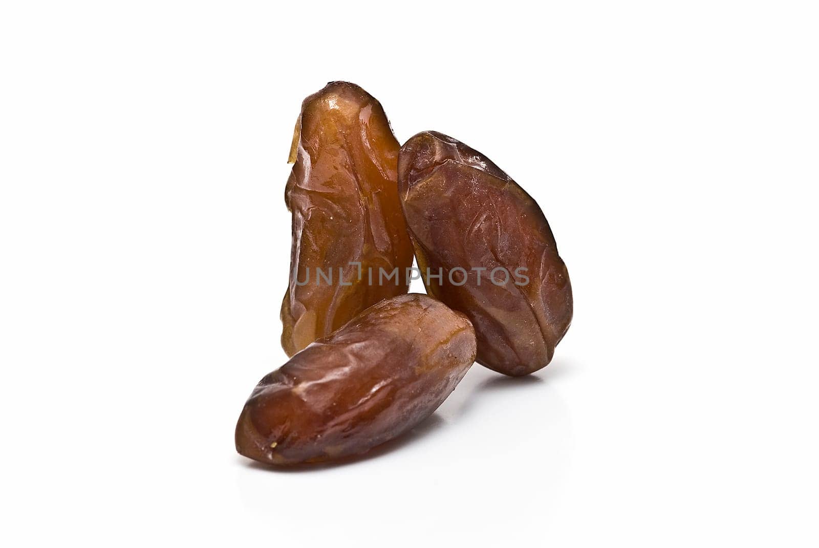 Date fruit isolated over a white background.