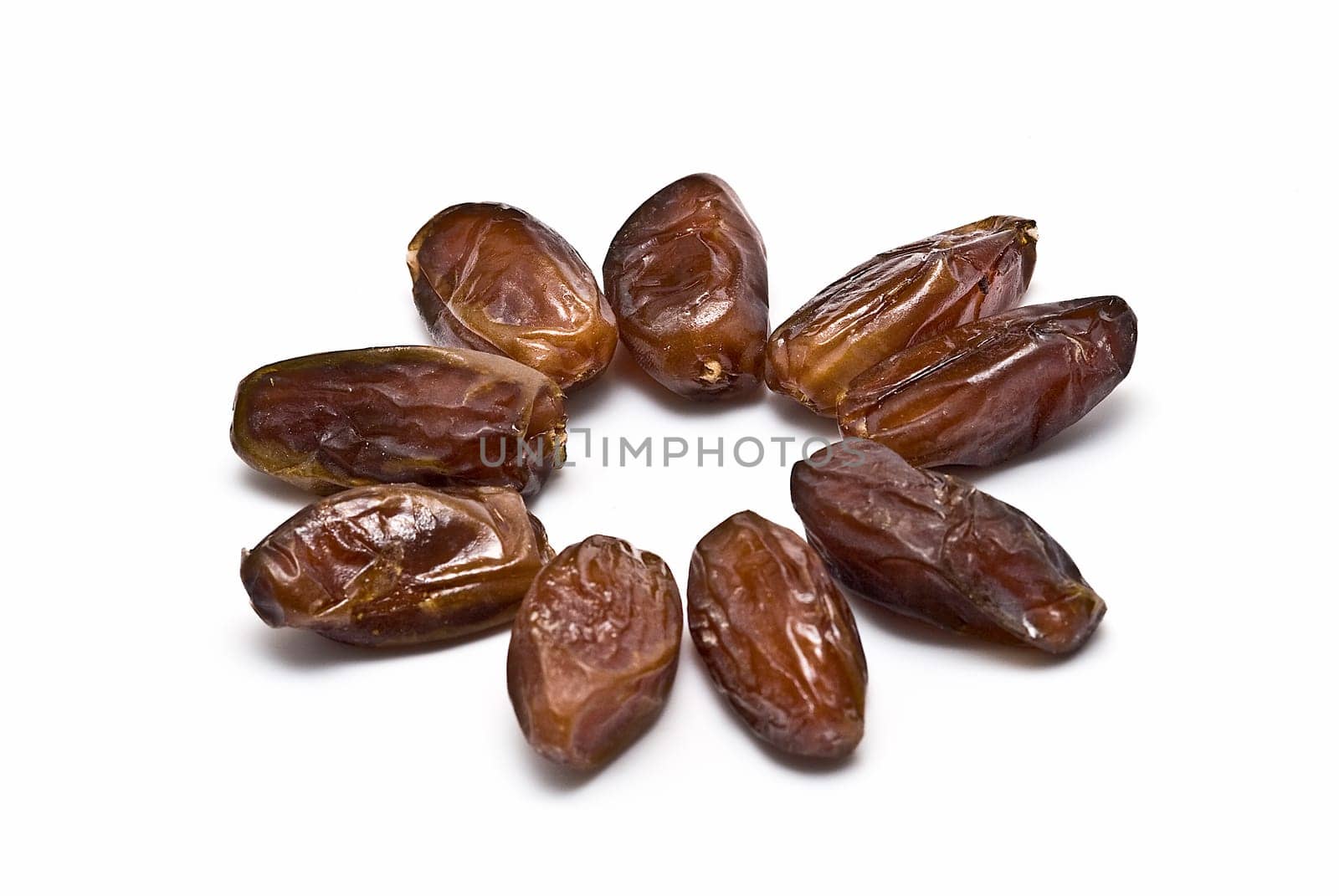 Date fruit isolated over a white background.