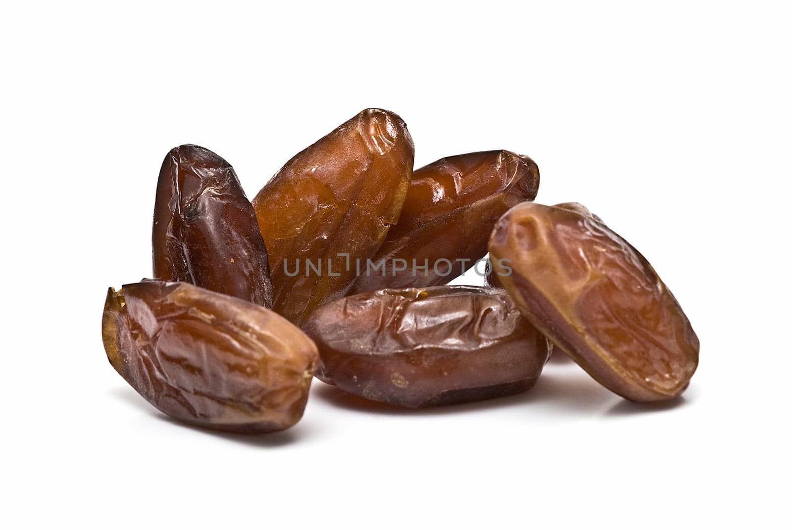Date fruit isolated over a white background.