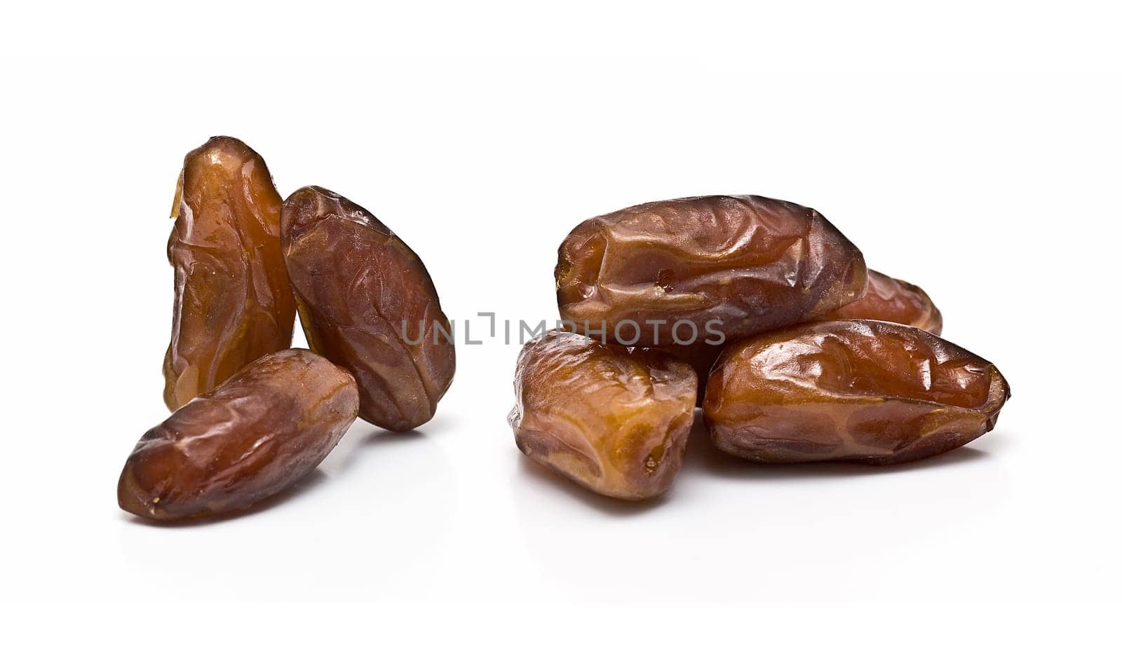 Date fruit isolated over a white background.