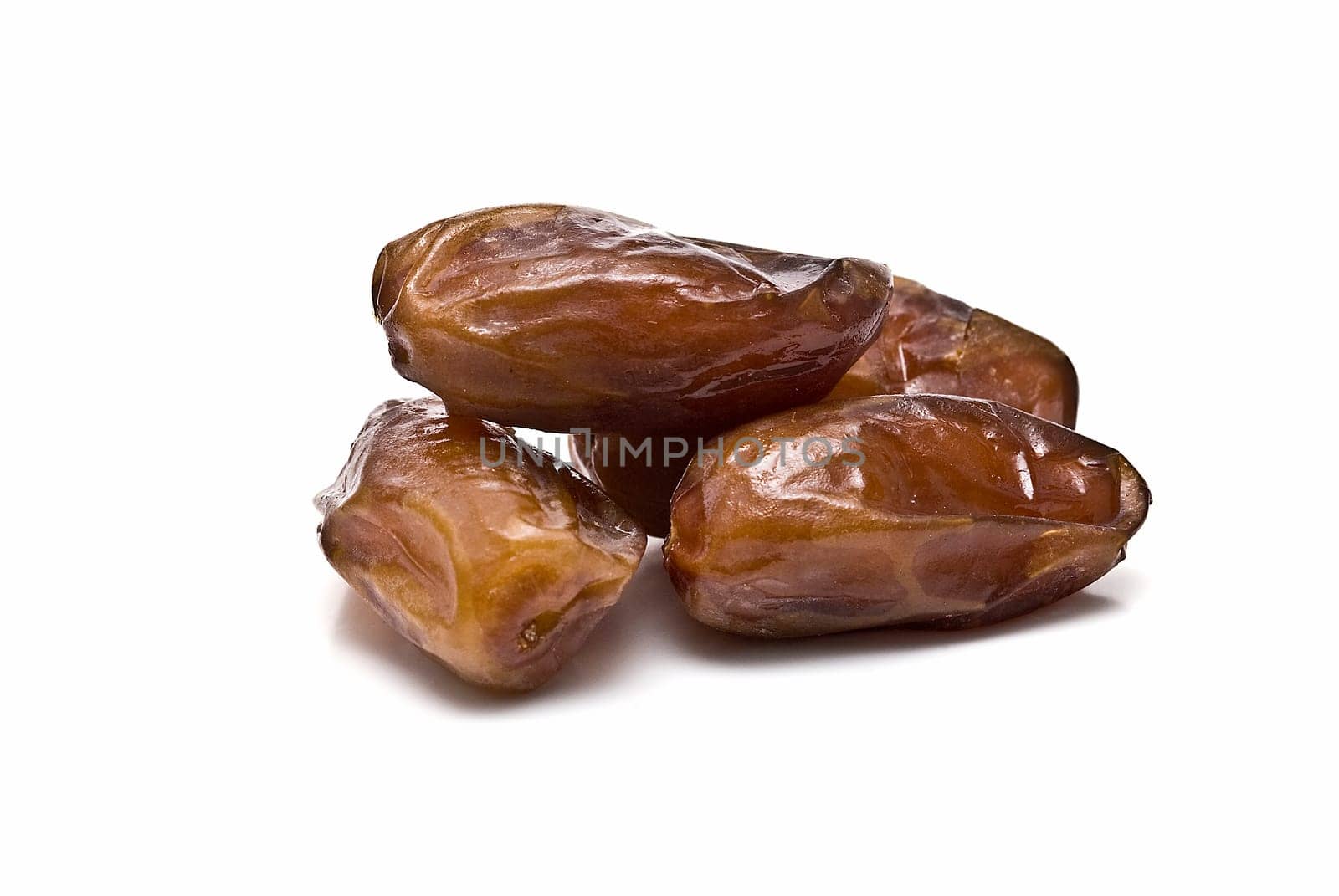 Date fruit isolated over a white background.