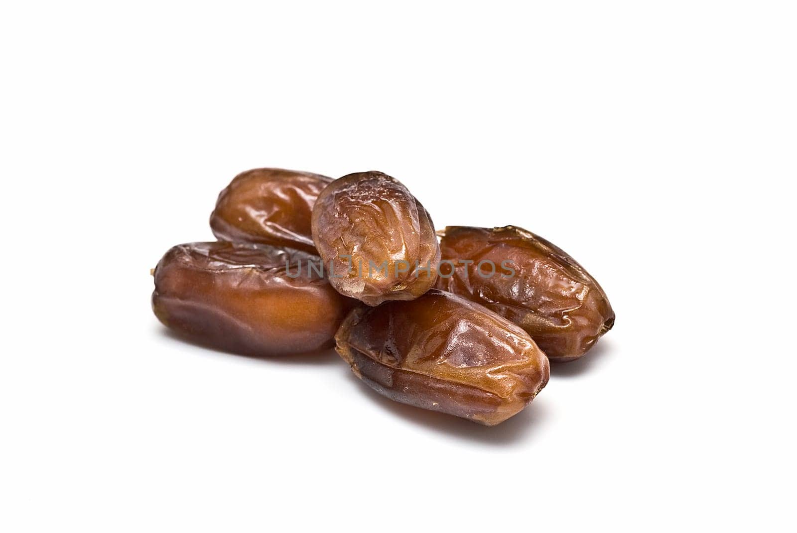 Date fruit isolated over a white background.