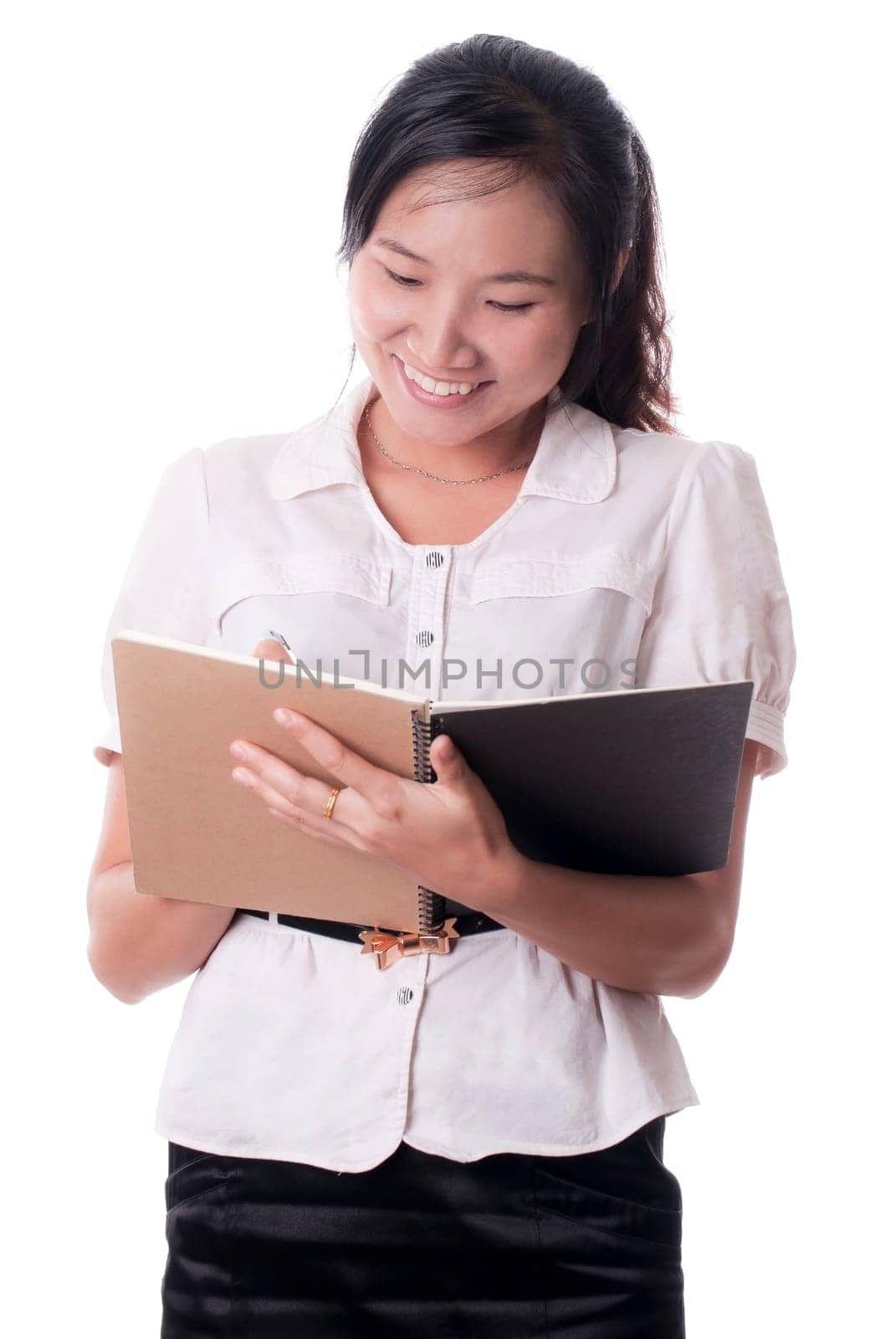 A Asian female secretary recording the notes with the sweet smiles on the white
