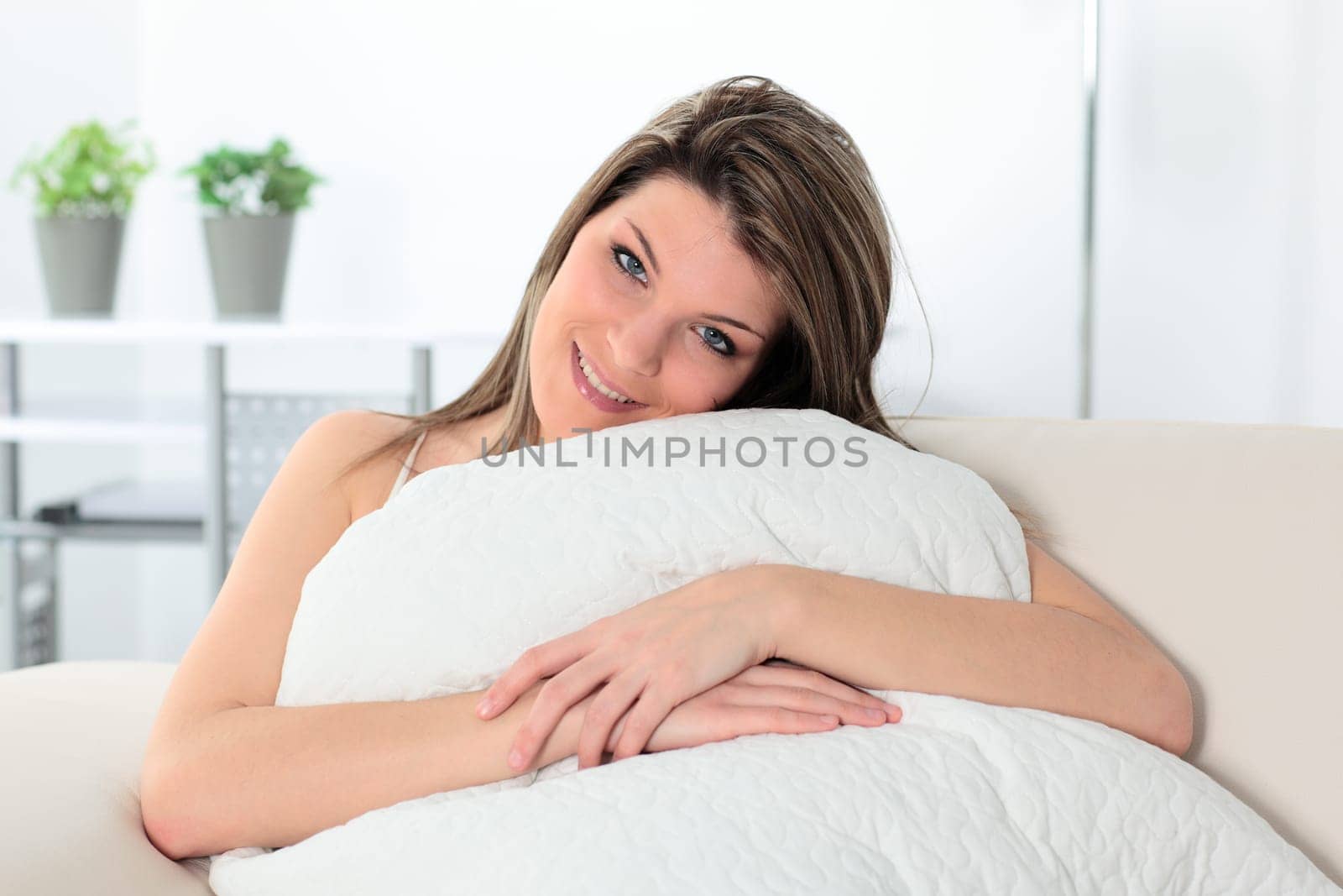 happy woman on a sofa at home